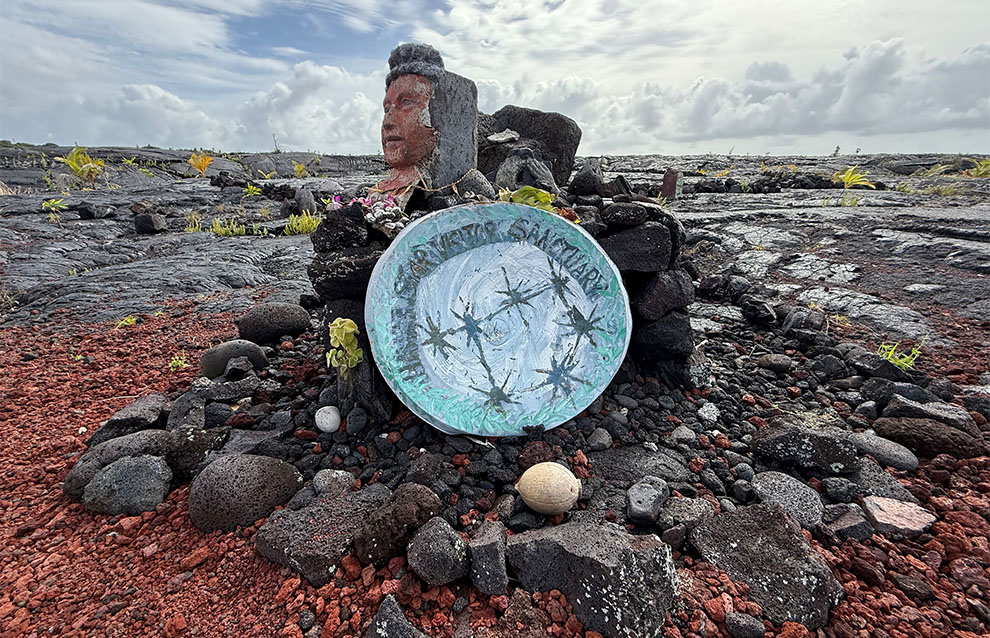 a pile of rocks with mementos of various items, from plates to sculptures